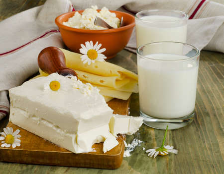 Fresh milk and dairy products on a wooden table. Selective focusの写真素材