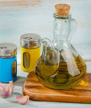 Olive oil and spices on a wooden table. Selective focusの写真素材