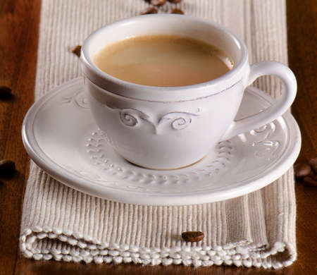 Coffee cup on a wooden table. Selective focusの写真素材