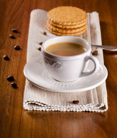 Coffee cup and cookies on wooden table. Selective focusの写真素材