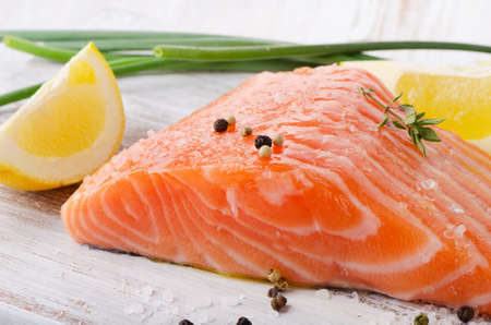 Salmon on a wooden board . Selective focusの写真素材