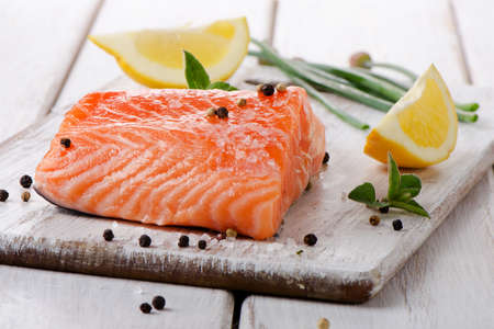Salmon on a wooden board . Selective focusの写真素材