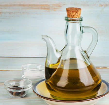 Olive oil on a wooden table. Selective focusの写真素材