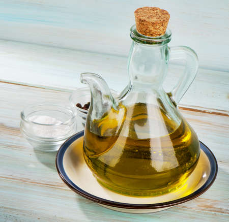 Olive oil on a wooden table. Selective focusの写真素材