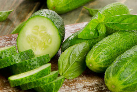 Fresh cucumbers on a wooden table. Selective focusの写真素材