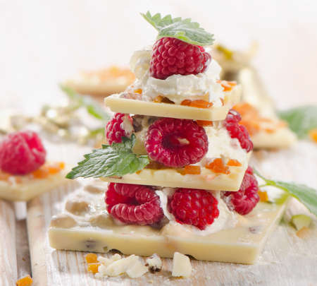 Sweet chocolate christmas tree with berries and mint. Selective focusの写真素材