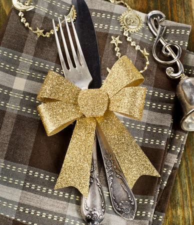 Christmas table setting  on a wooden table.の写真素材