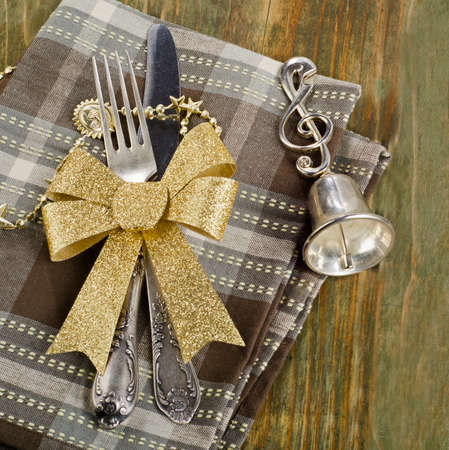 Christmas table setting  on a wooden table.の写真素材