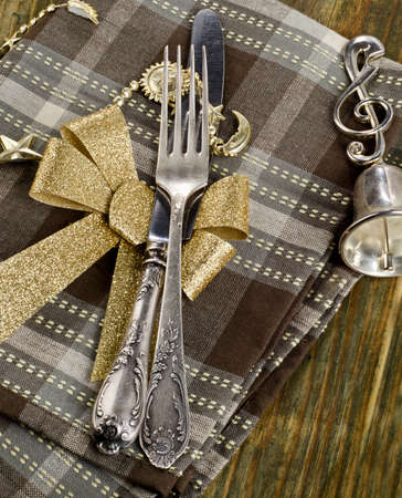 Christmas table setting  on a wooden table.の写真素材