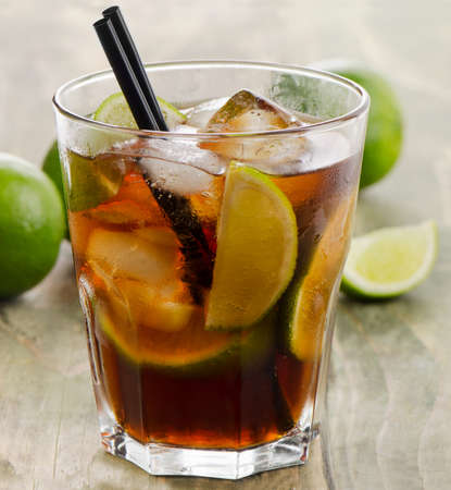 Cuba Libre cocktail on a wooden table. Selective focusの写真素材