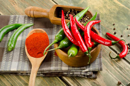 Chili Peppers on a wooden background. Selective focusの写真素材