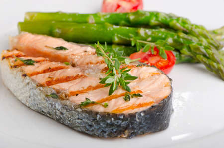 Salmon with  asparagus  and  herbs . Selective focusの写真素材
