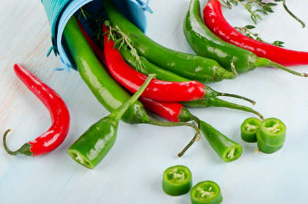 Red and green Chili Peppers on wooden background. Selective focusの写真素材