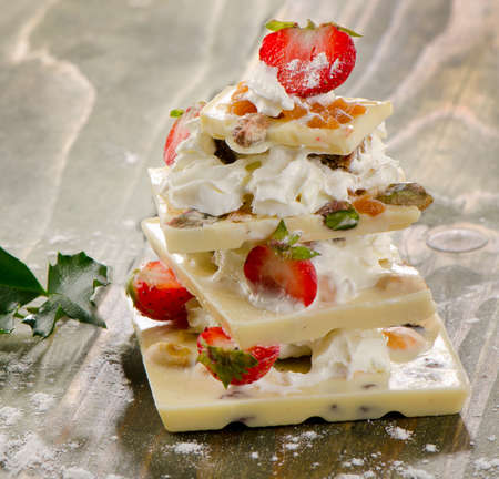 White  Chocolate sweet christmas tree with strawberries . Selective focusの写真素材