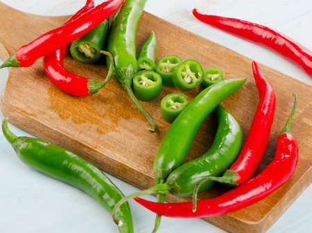 Hot Chili Peppers on a  wooden board. Selective focusの写真素材