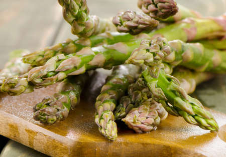 Bunch of  asparagus on wooden table. Selective focusの写真素材