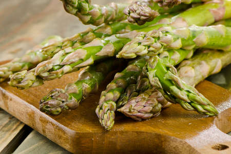 Asparagus on a wooden table. Selective focusの写真素材