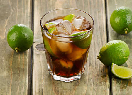 Cocktail with lime on a wooden table. Selective focusの写真素材