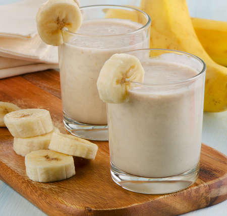 Two glasses of Banana smoothie . Selective focusの写真素材