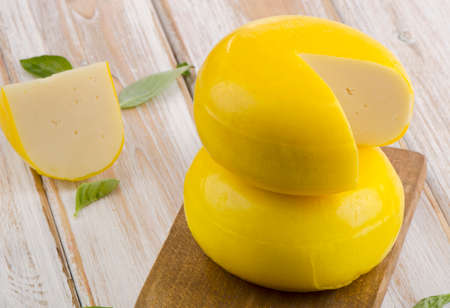 Cheese  on a wooden board Selective focus