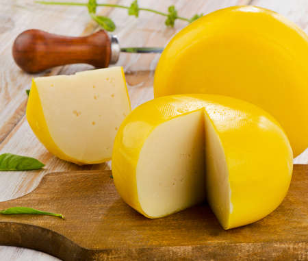 Cheese  with herbs on a wooden table. Selective focusの写真素材