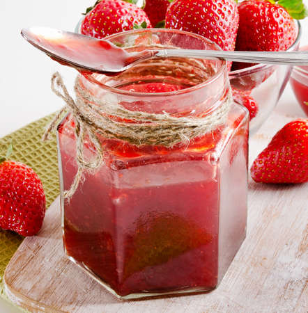 Strawberries marmalade on a wooden table. Selective focusの写真素材