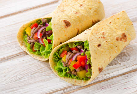 tortilla wraps with meat and fresh vegetables. Selective focusの写真素材