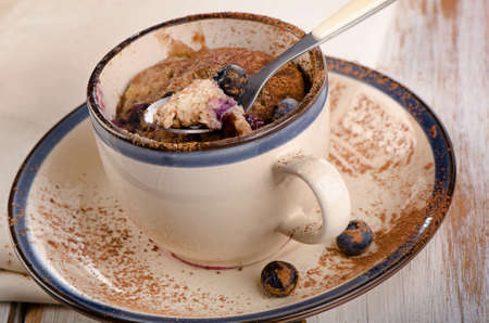 Microwave Muffin in a mug. Selective focusの写真素材