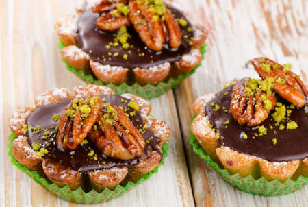 Sweet Chocolate Cupcakes on a wooden table. Selective focusの写真素材