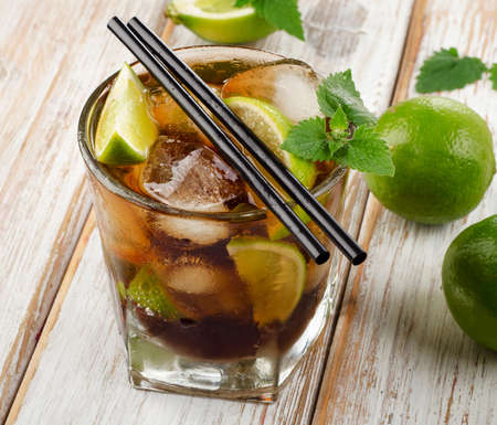 Cuba Libre Drink with mint on a  wooden table. Selective focusの写真素材