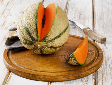 Ripe melon  on  wooden table. Selective focusの写真素材