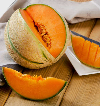 Melon  on  wooden background. Selective focusの写真素材