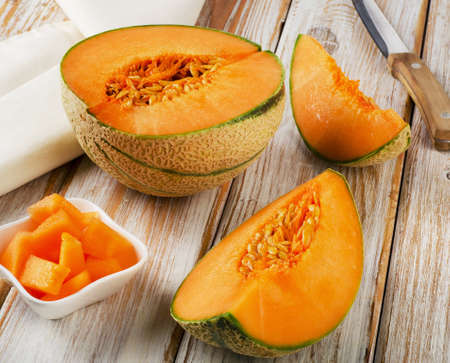 Ripe melon  on a  wooden background. Selective focusの写真素材