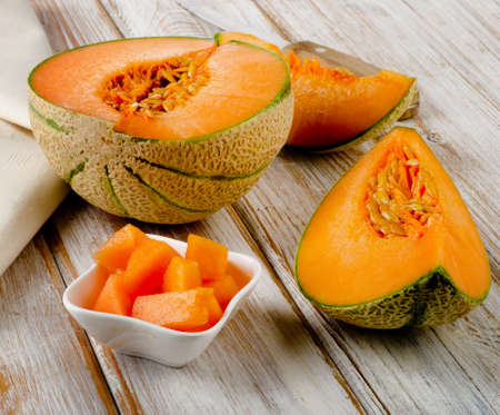 Ripe melon  on  wooden background. Selective focusの写真素材