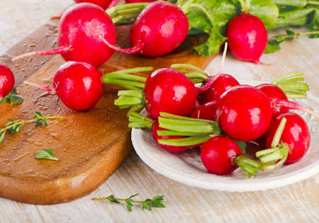 Radishes on a  wooden board. Selective focusの写真素材