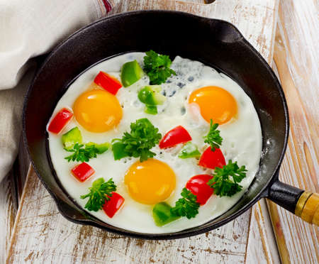 Healthy  breakfast - Fried eggs  with vegetables. Selective focusの写真素材