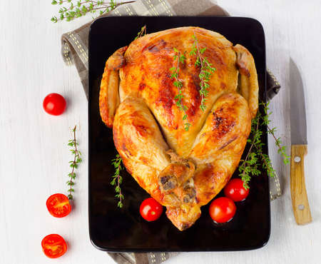 whole roasted chicken on plate. Selective focusの写真素材