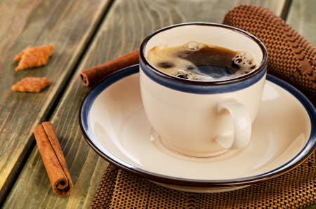 Cup of coffee and cookies on a wooden table. Selective focusの写真素材