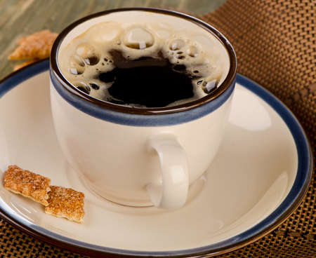Cup of coffee on wooden table. Selective focusの写真素材