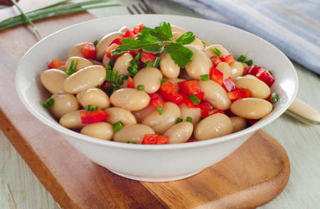 Salad with white beans on a wooden table. Selective focusの写真素材