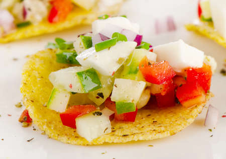 Nachos with vegetables and cheese. Selective focusの写真素材