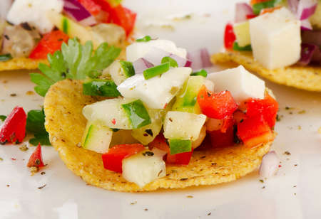 Corn nachos with vegetables and cheese. Selective focusの写真素材