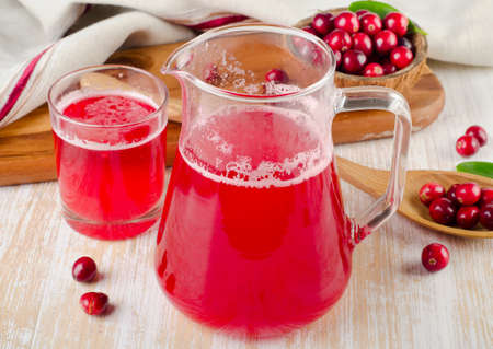 Cranberry drink with fresh berries on  wooden の写真素材