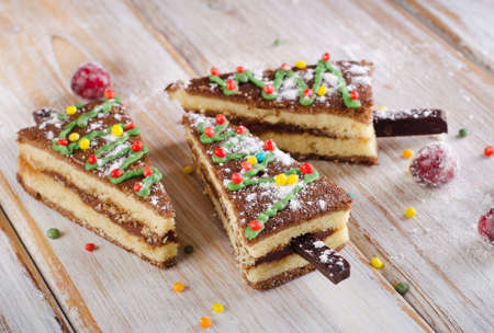 Christmas tree made of  cake on a wooden table . Selective focusの写真素材