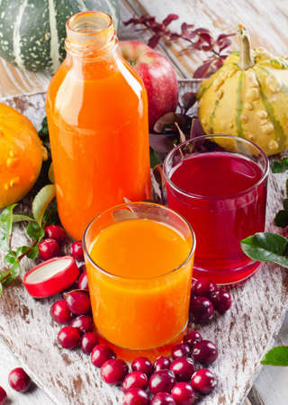 Bottle  of  fresh juice  - autumn still life. Selective focusの写真素材