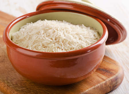 Rice in  clay brown bowl. Selective focusの写真素材