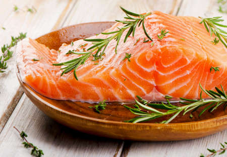 Fresh raw salmon fillet on cutting board. Selective focusの写真素材