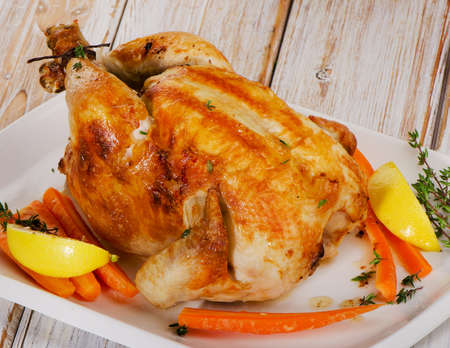 Roasted chicken  on a  white plate. Selective focusの写真素材