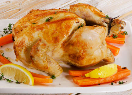 Roasted chicken  on a  wooden board. Selective focusの写真素材