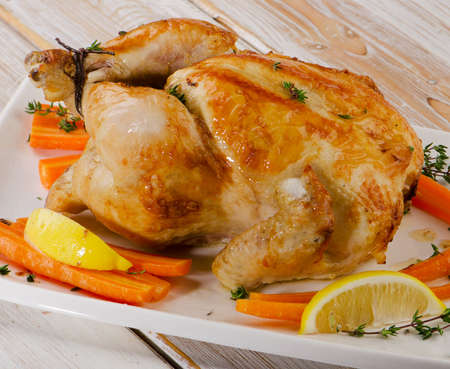 Roasted chicken  on   wooden board. Selective focusの写真素材